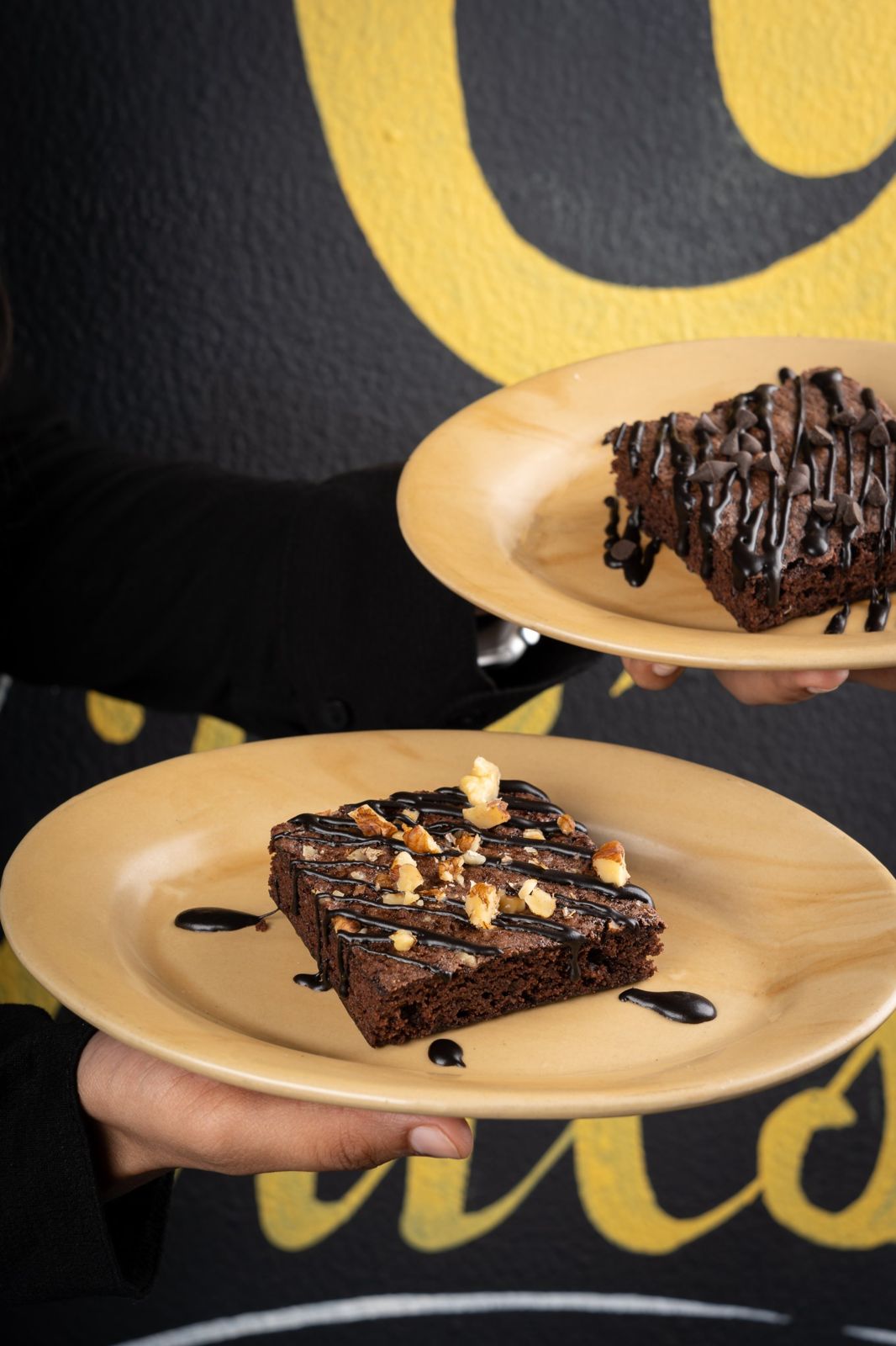 Two brownies with chocolate drizzle