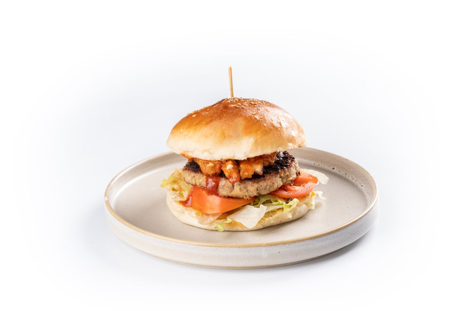 Grilled chicken burger with tomato and lettuce